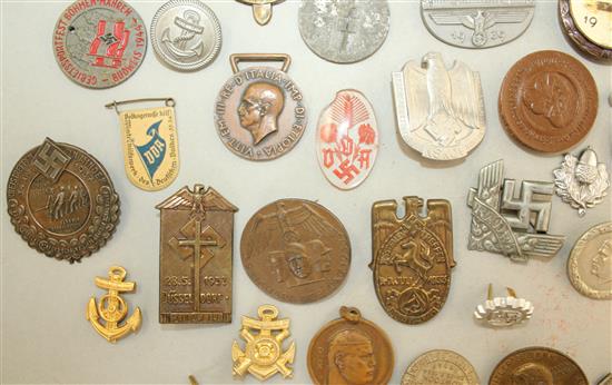 A large collection of various German Third Reich badges,
